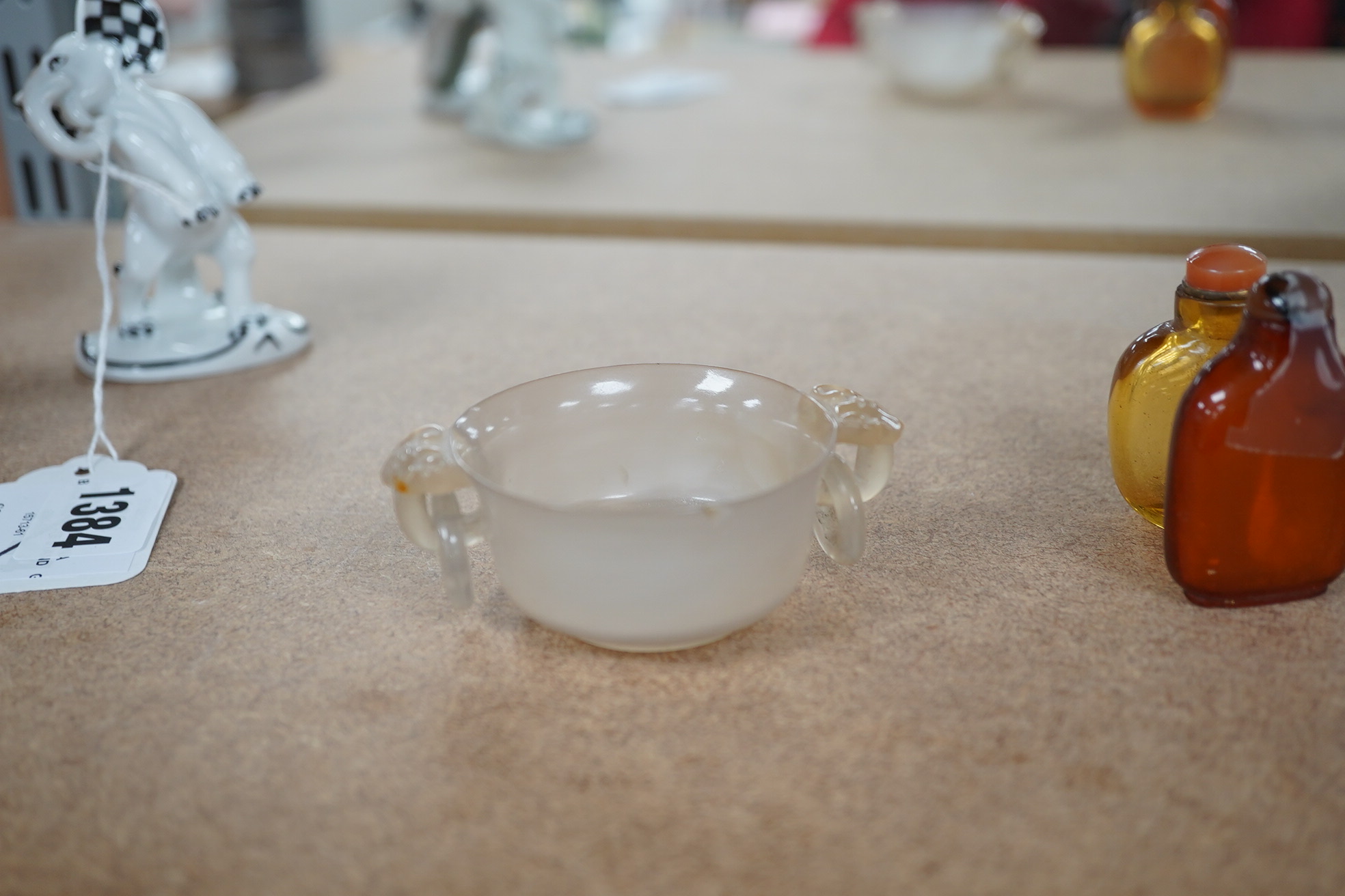 Two Chinese snuff bottles, amber and orange glass, and a similar bowenite bowl, 8cm. Condition - fair